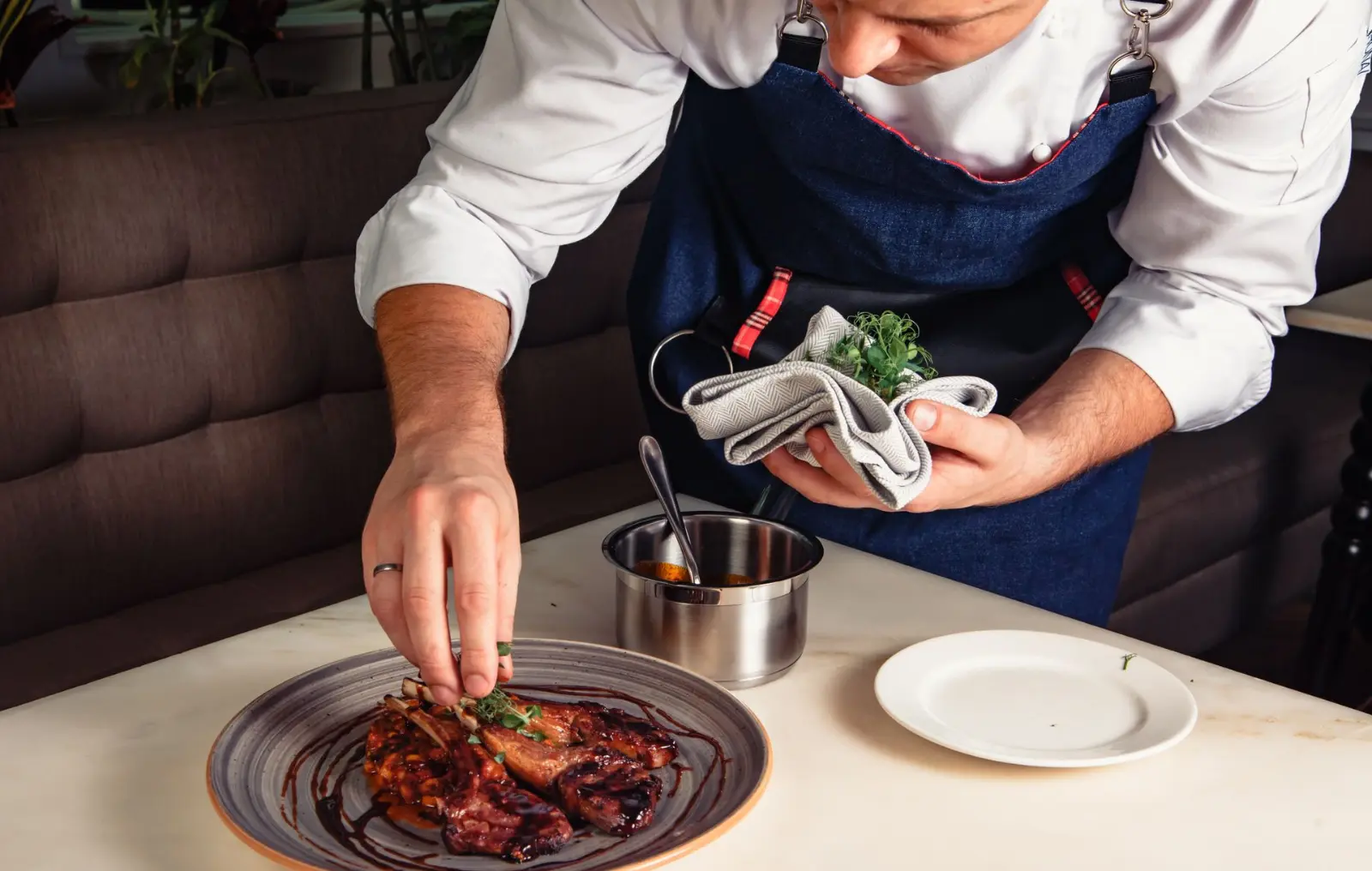 Restaurant owner preparing food